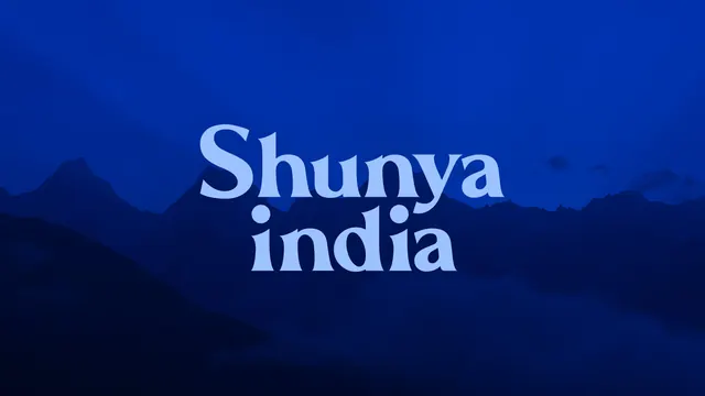 Shunya India wordmark divider over mountain photograph