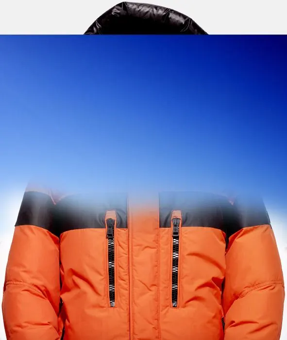Orange and navy puffer jacket hero shot, photographic, minimal, dark