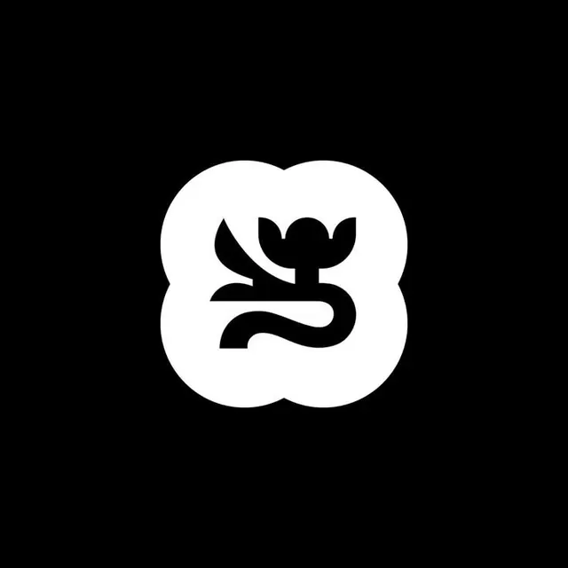 Quatrefoil logo with negative-space flower, minimal, abstract, dark