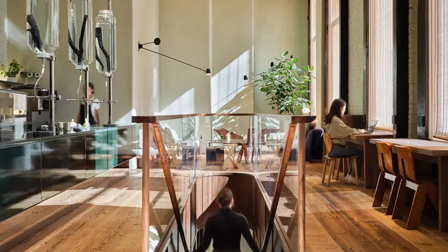 Sunlit matcha cafe interior with timber and glass, photographic, architectural, warm
