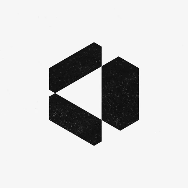 Faceted hexagon logo mark with play-triangle cutout, minimal, geometric, dark