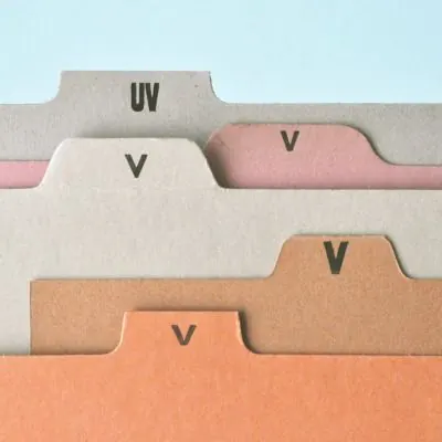 Stacked file-tab cards in earthy paper tones, minimal, organic, earthy