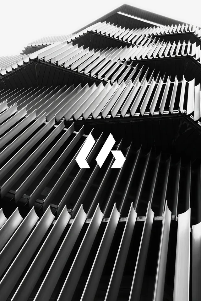 Angular monogram over louvred facade, minimal, geometric, dark