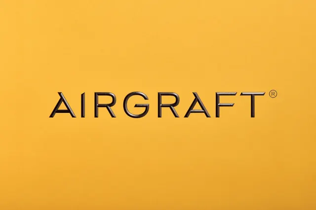 AIRGRAFT wordmark on mustard yellow, minimal, corporate-clean, warm