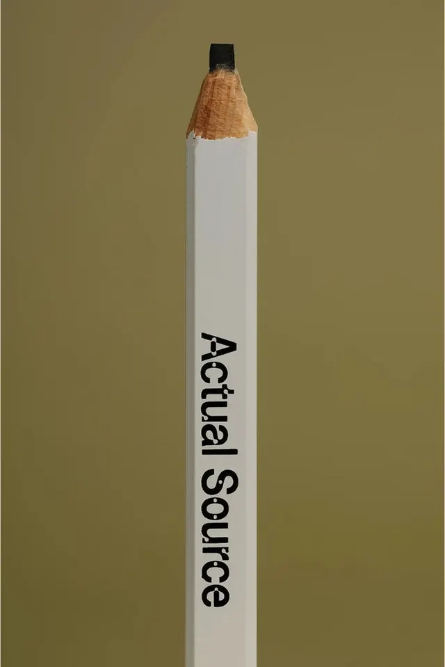 Branded white pencil on olive backdrop, minimal, photographic, earthy