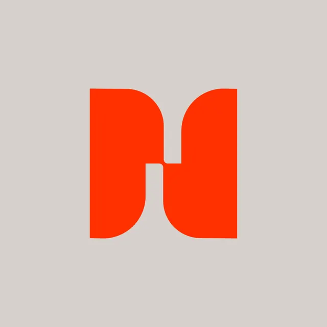 Orange letter-M monogram on warm grey, minimal, geometric, warm