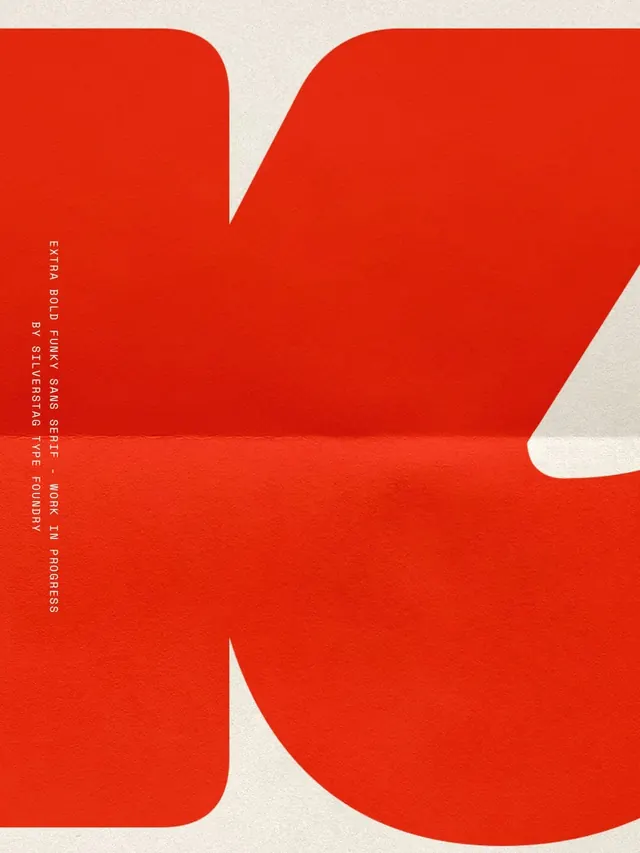 Oversized red sans-serif type specimen, minimal, geometric, light