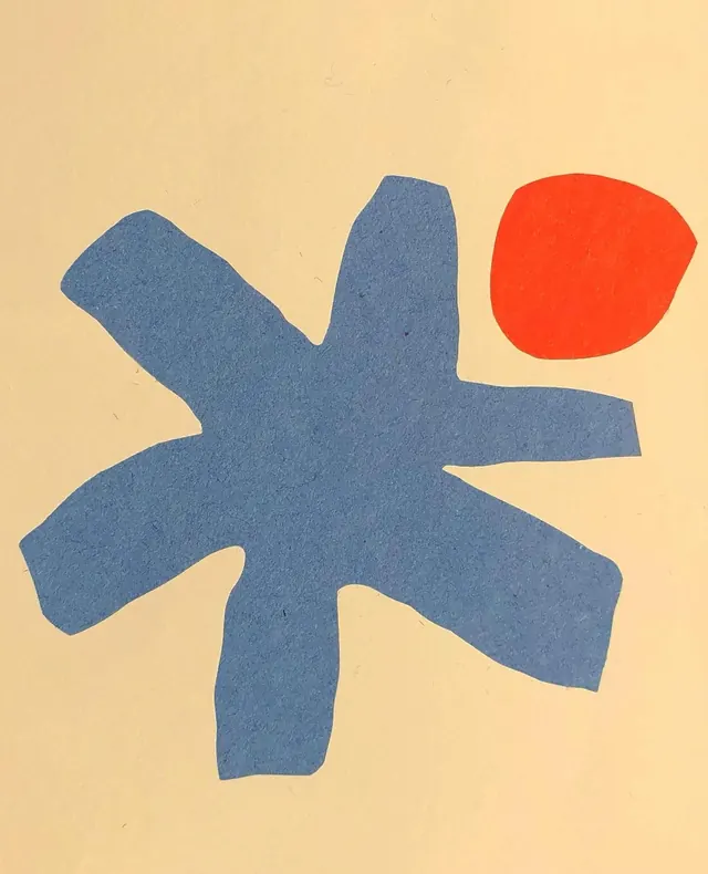 Cut-paper blue burst and orange dot, abstract, organic, light