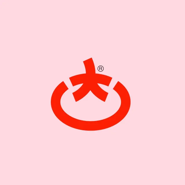 Red CJK-character logomark on pink, minimal, geometric, vibrant