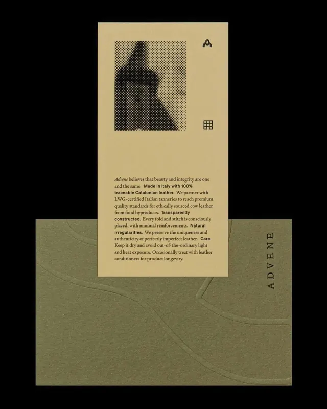 Leather-brand card tucked in embossed olive sleeve, editorial, minimal, earthy