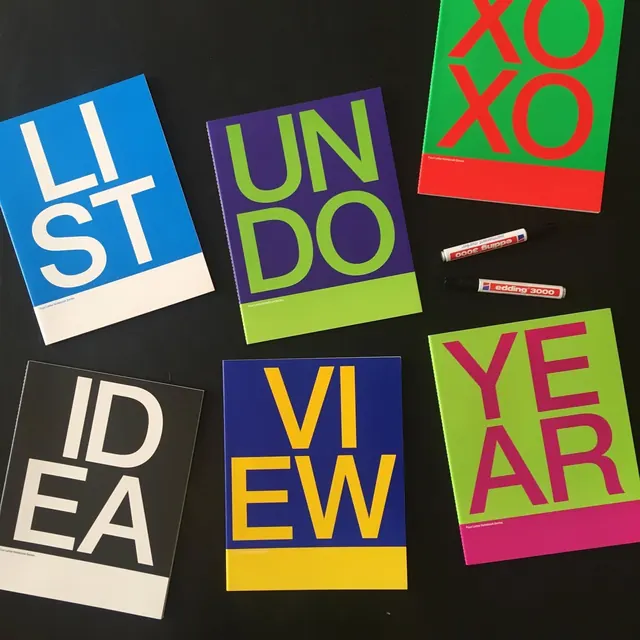 Four-Letter Notebook Series flat-lay covers, swiss, geometric, dark