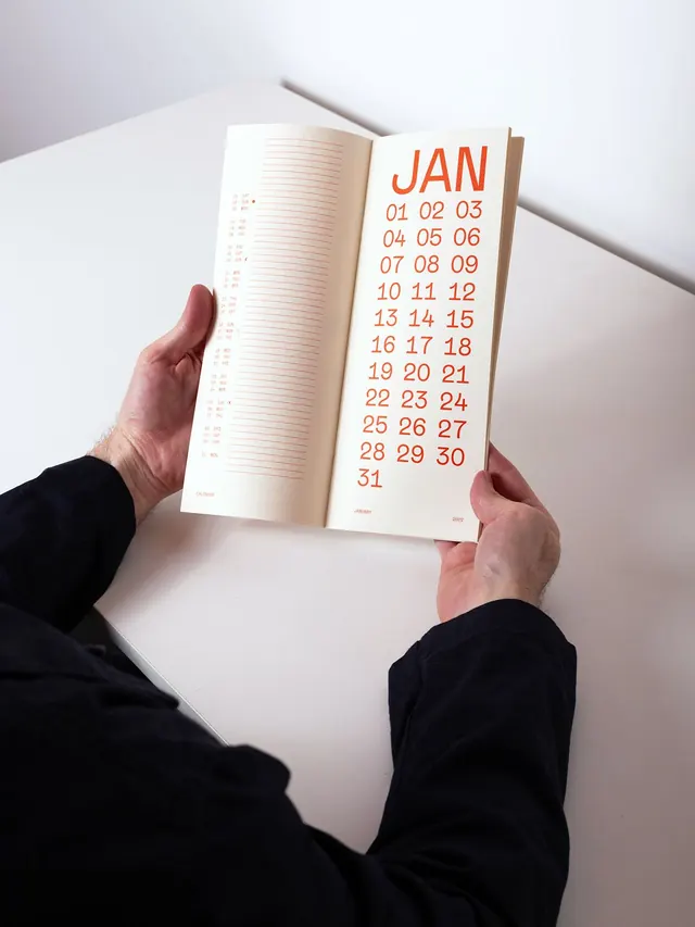Minimal calendar page with monochromatic display type, minimal, editorial, light