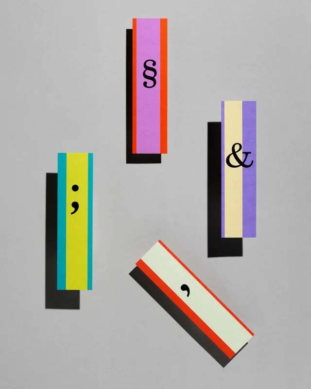 Modular cards with color-band frames and punctuation, abstract, minimal, warm