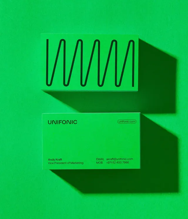 Unifonic brand identity with lime-green wavy mark and drop-shadow business card, minimal, corporate-clean, dark