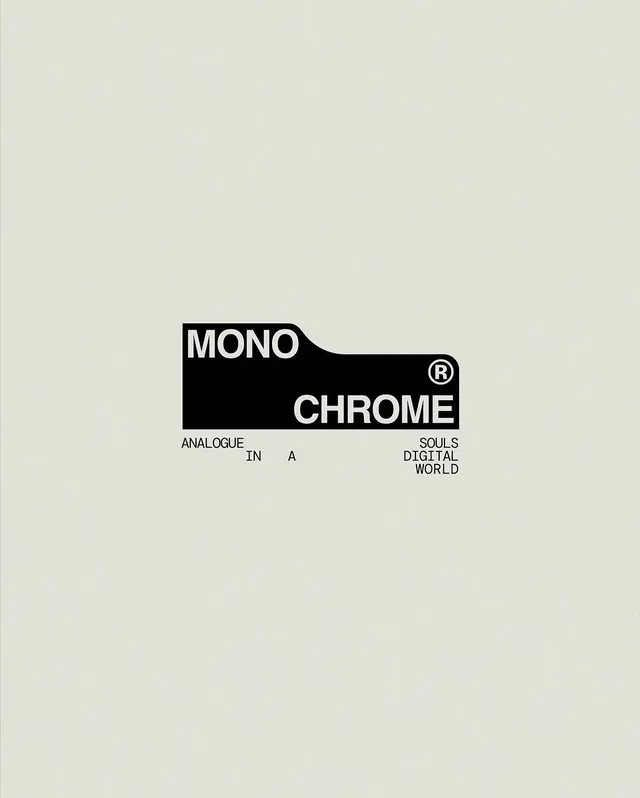 Monochrome branded wordmark with angled shape, minimal, geometric, dark