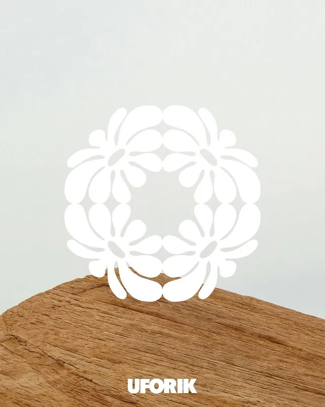 UFORIK botanical brand mark on wood, minimal, organic, light