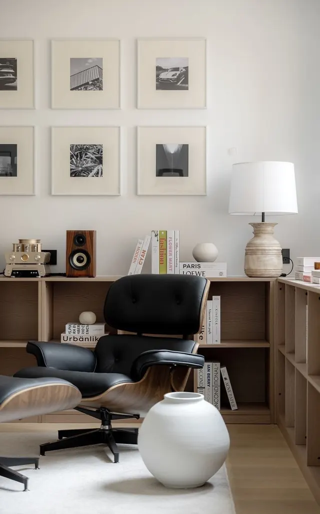 Scandinavian minimalist workspace with monochromatic gallery wall, minimal, monochrome, dark