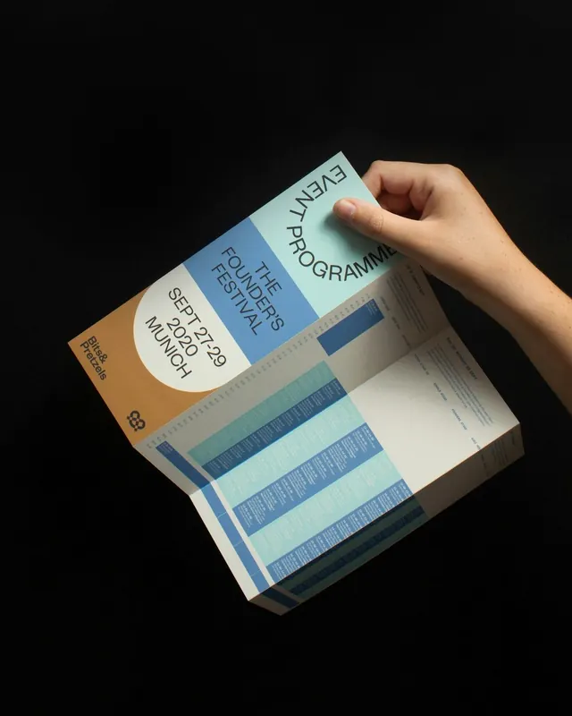 Eight Bars festival brochure with color-blocked spine and teal accents, minimal, editorial, cool
