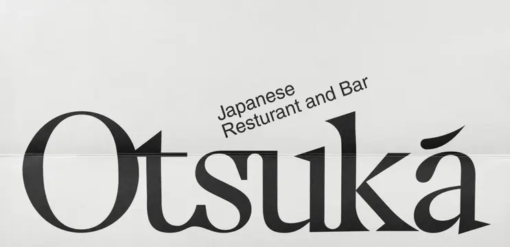 Otsuka Japanese restaurant logotype, minimal, editorial, dark