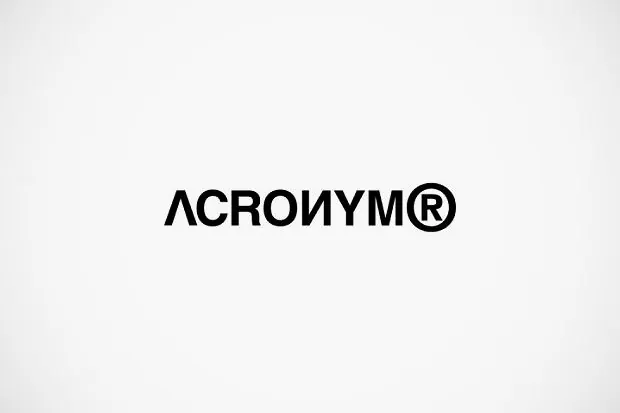 ACROIUM: bold geometric wordmark with registered mark, minimal, corporate-clean, dark