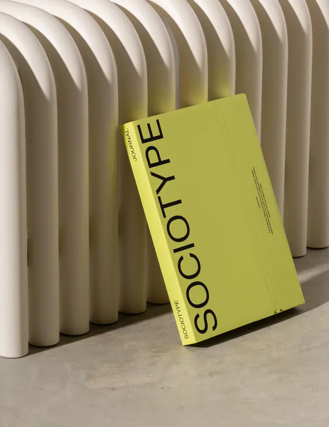 Sociotype publication with lime-yellow cover, minimal, photographic, light