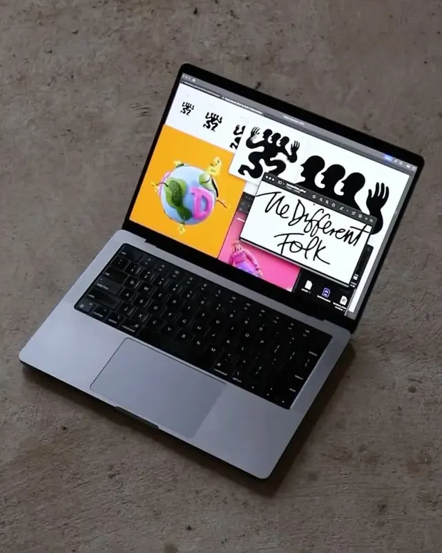 Colorful digital design interface on laptop screen, playful, illustrated, warm