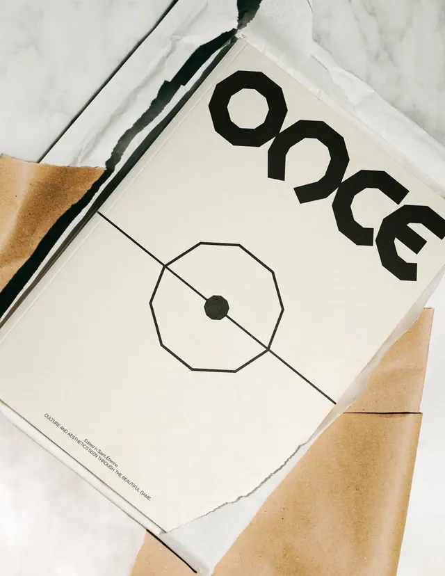 Editorial spread with octagon logo and line drawings, minimal, editorial, light