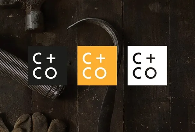 C + CO logo variations on wood, minimal, corporate-clean, dark