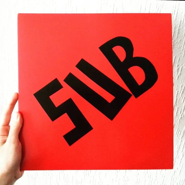 5UB Wordmark on Red Square