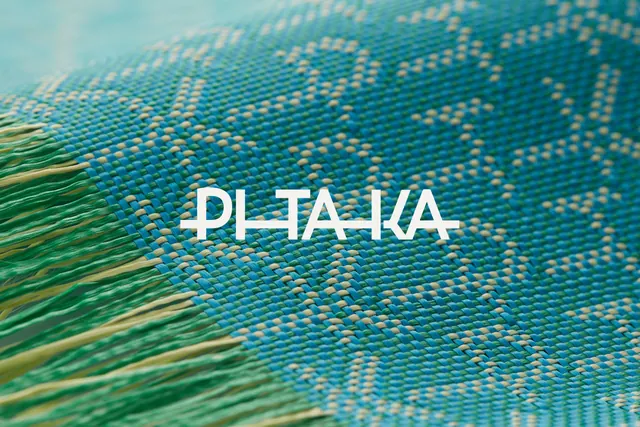 Woven textile texture with white sans-serif mark, organic, photographic, cool