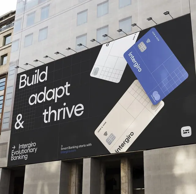 Intergiro fintech billboard with angled card mockups, minimal, corporate-clean, light