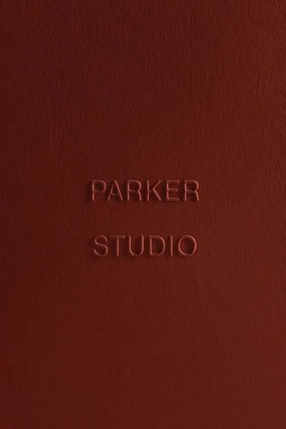 Parker Studio blind emboss on terracotta, minimal, luxury, warm