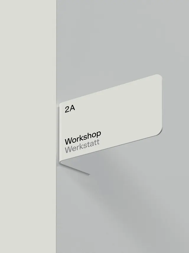 Grau bilingual corner wayfinding sign, minimal, swiss, light