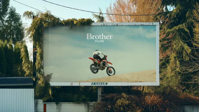 Brother Films billboard with motocross still, photographic, cinematic, muted