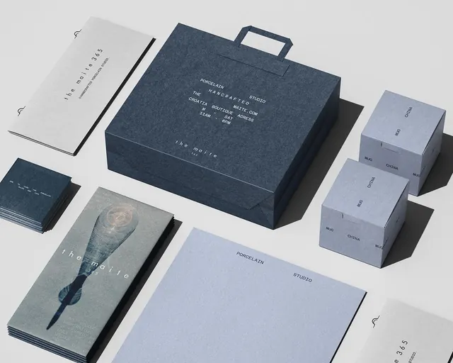 Luxury ceramics brand identity flat-lay, minimal, photographic, light
