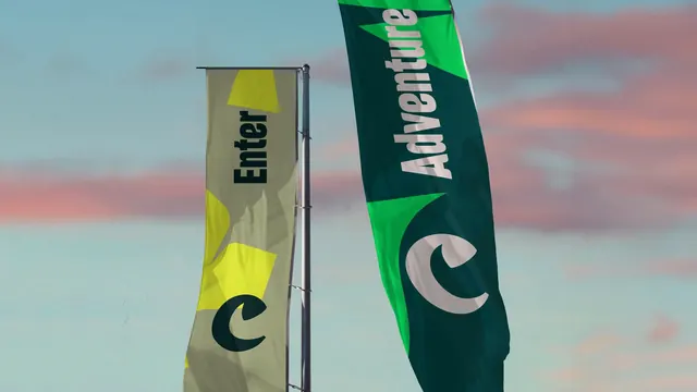 Chester Zoo entrance flags at dusk, photographic, typographic, vibrant