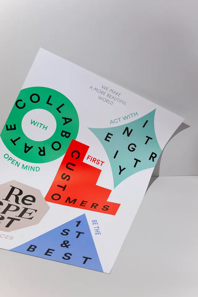 Geometric modular logo system on folded paper, geometric, corporate-clean, vibrant