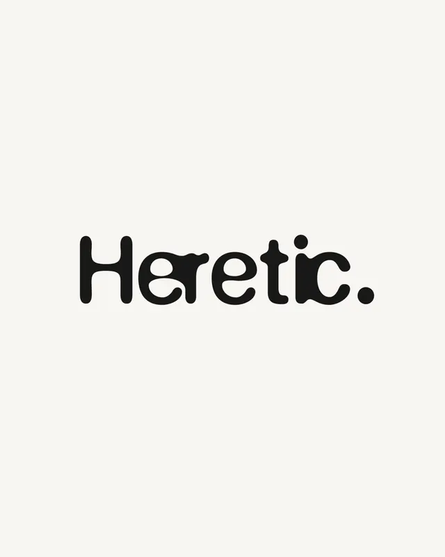 Heretic playful rounded wordmark, minimal, monochrome, dark