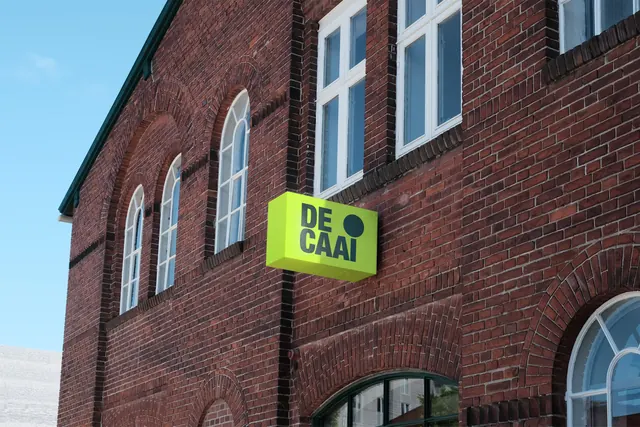 DE CAAI green box sign on brick, minimal, geometric, neon