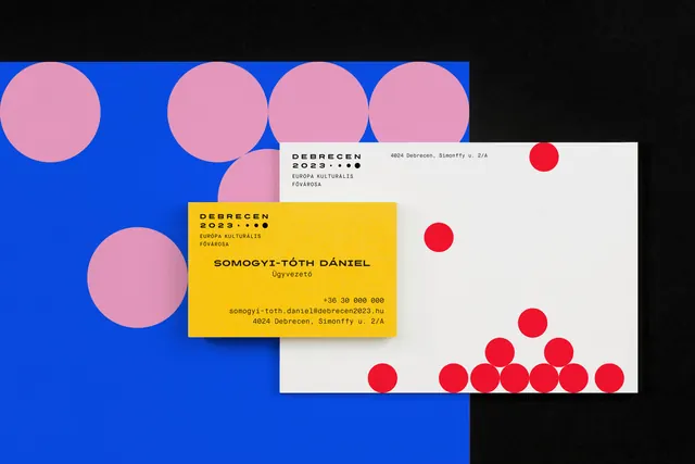 Debrecen 2023 stationery on blue and pink circle field, geometric, swiss, vibrant