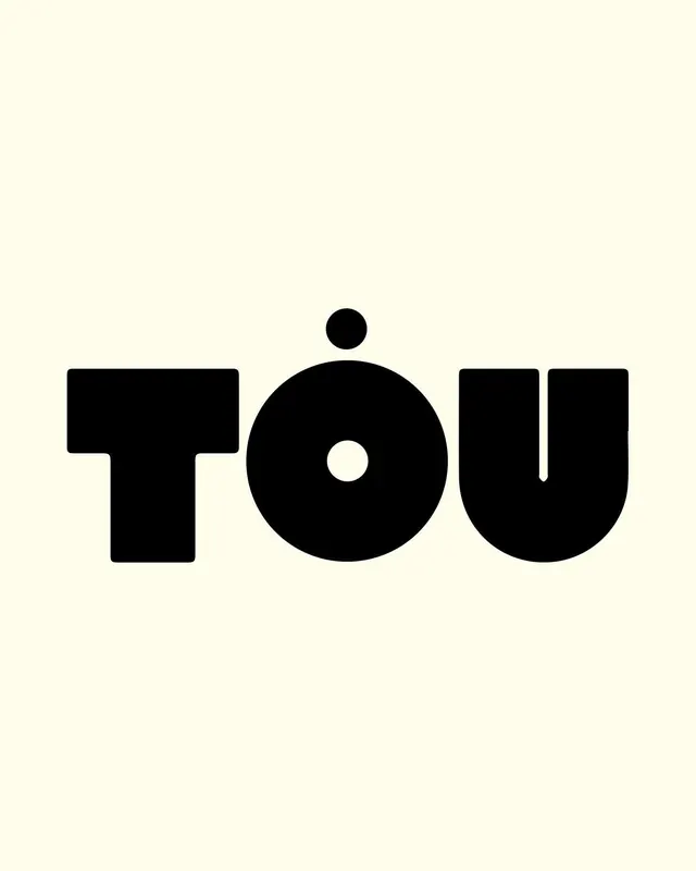 TOU monogram with floating dot accent, minimal, geometric, dark