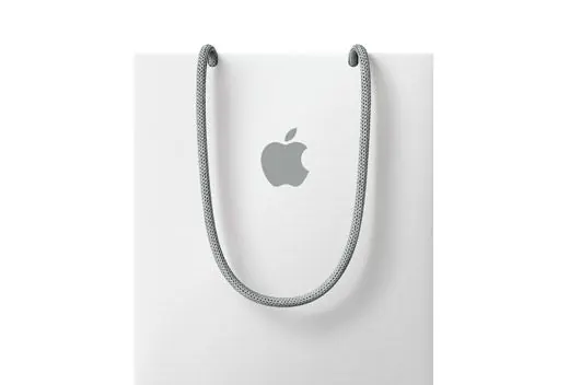 Apple logo suspended on braided cord, minimal, photographic, light