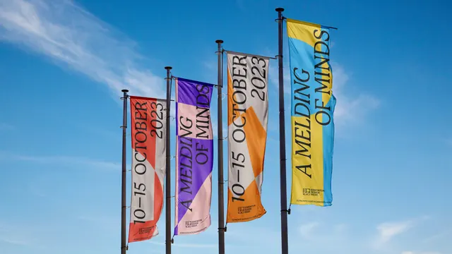 Edmonton Design Week pole banners against sky, geometric, typographic, vibrant