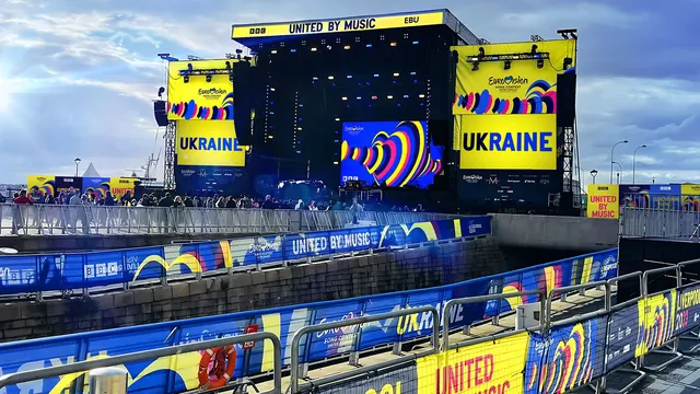Eurovision 2023 waterfront stage and fan zone dressing, photographic, flat, vibrant