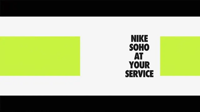 Nike Soho retail signage with lime accent blocks, minimal, corporate-clean, light