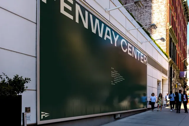 Fenway Center hoarding banner with cropped oversized wordmark, minimal, architectural, dark