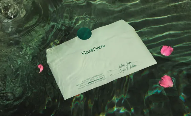 Flor and Fjaere gift envelope floating on water, minimal, organic, cool