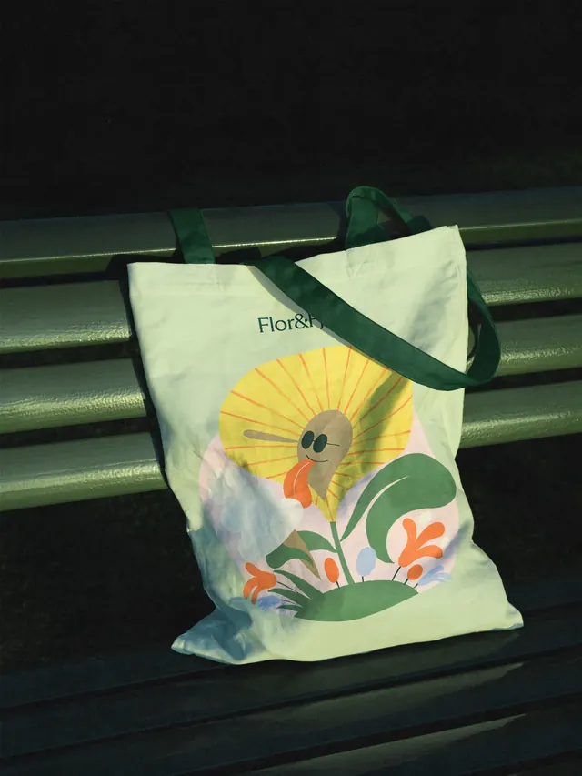 Flor and Fjaere tote with smiling flower illustration, illustrated, flat, earthy