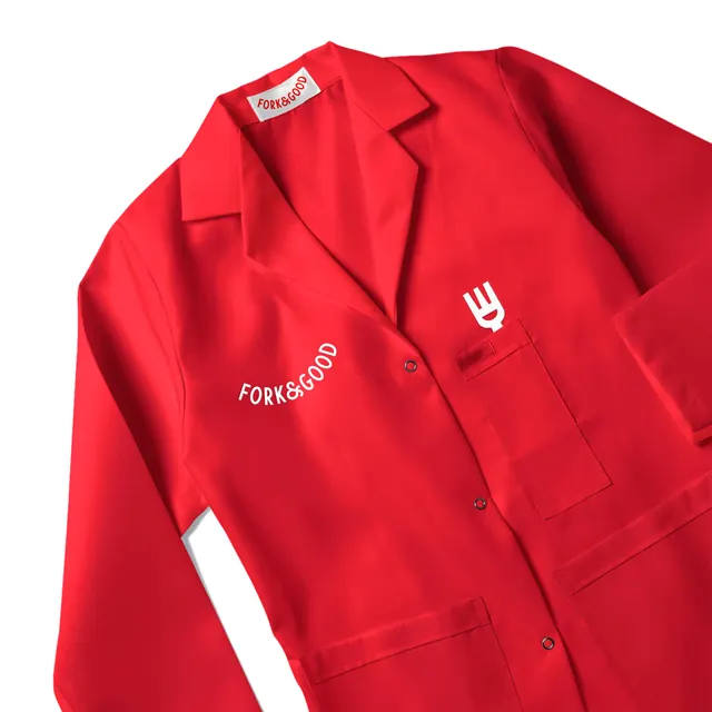 Fork & Good red work coat with curved wordmark, minimal, photographic, vibrant