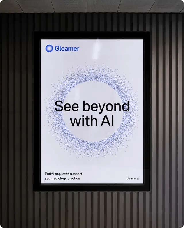 Gleamer "See beyond with AI" poster on wall-mounted screen, minimal, photographic, dark